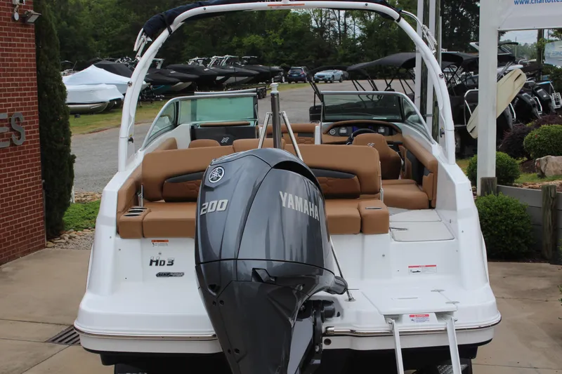 Slide: The Image of 2025 Four Winns HD3 OB boat with Yamaha 200 engine, displayed outdoors. - 4