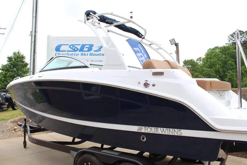 Slide: The Image of 2025 Four Winns HD3 OB boat displayed at Charlotte Ski Boats dealership. - 5