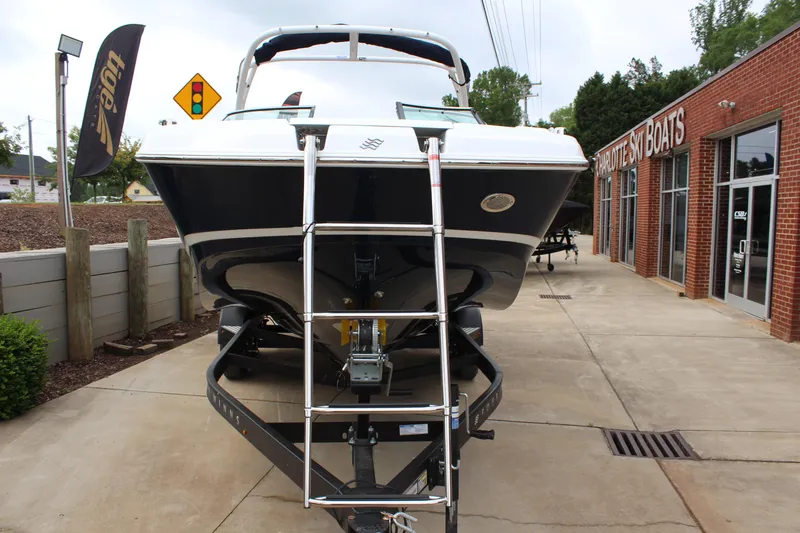 Slide: The Image of 2025 Four Winns HD3 OB boat on trailer at dealership. - 7