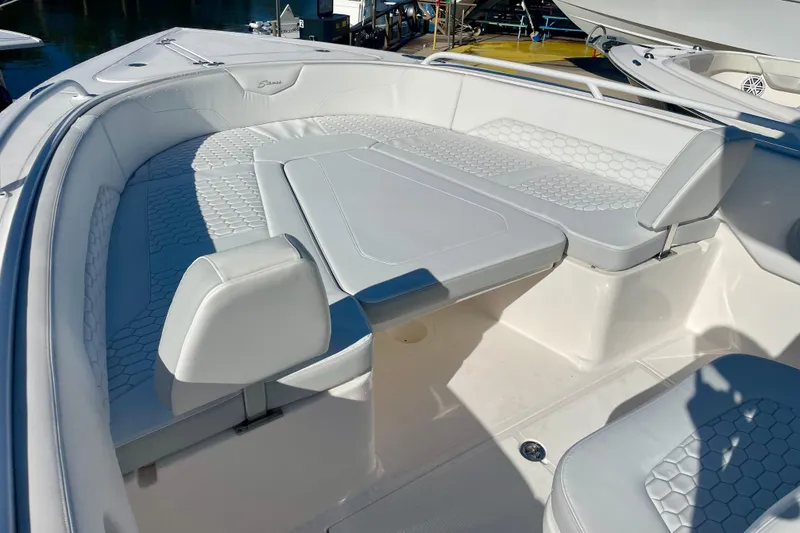 Slide: The Image of 2021 Stamas 31 Adventura boat interior with white seating and table. - 10
