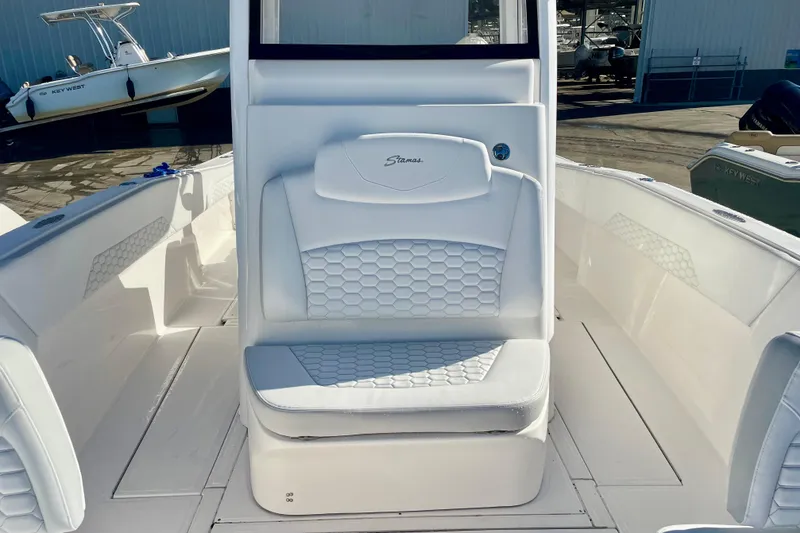 Slide: The Image of 2021 Stamas 31 Adventura boat interior with white seating and hexagonal pattern. - 13