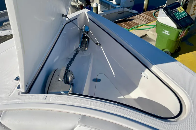 Slide: The Image of Anchor storage compartment on a 2021 Stamas 31 Adventura boat, open and empty. - 15