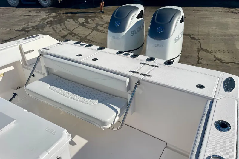 Slide: The Image of 2021 Stamas 31 Adventura boat with dual Suzuki engines and white seating. - 17