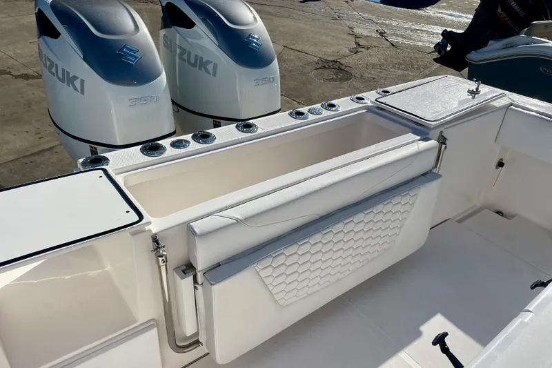 Slide: The Image of 2021 Stamas 31 Adventura boat with Suzuki 350 engines and sleek white seating. - 18