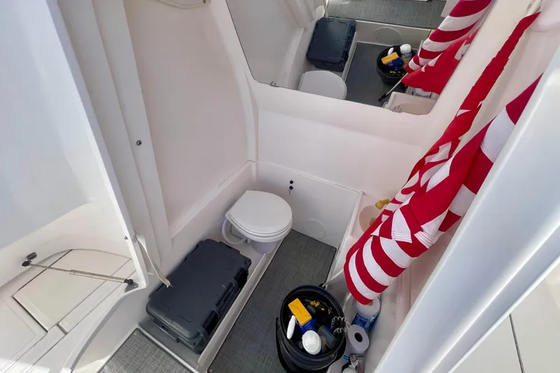 Slide: The Image of 2021 Stamas 31 Adventura boat interior with toilet and storage area. - 22