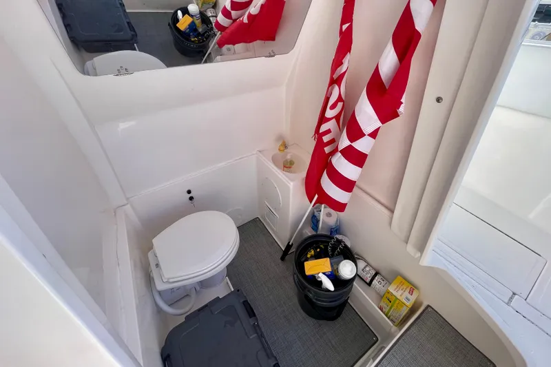 Slide: The Image of Interior of 2021 Stamas 31 Adventura boat with toilet and storage area. - 23