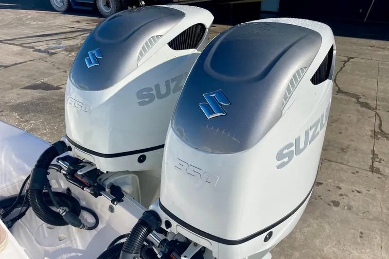 Slide: The Image of Twin Suzuki 350 outboard engines on a 2021 Stamas 31 Adventura boat. - 24