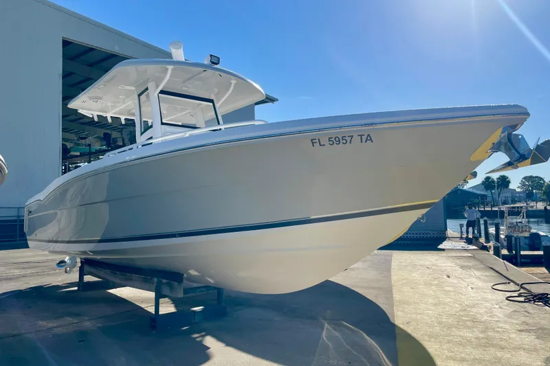 Slide: The Image of 2021 Stamas 31 Adventura boat docked under clear blue sky. - 4