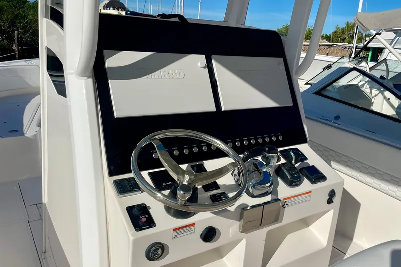 Slide: The Image of 2021 Stamas 31 Adventura helm with dual Simrad displays and modern controls. - 5