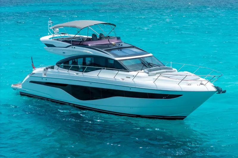 Slide: The Image of Luxurious 2021 Princess S62 yacht cruising in clear turquoise waters. - 1