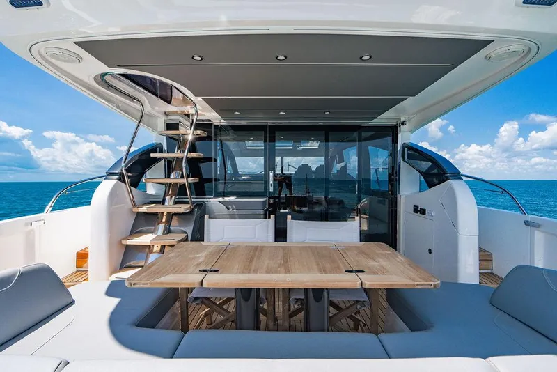 Slide: The Image of Luxurious 2021 Princess S62 yacht deck with seating, table, and ocean view. - 11
