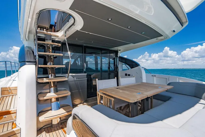 Slide: The Image of Luxurious 2021 Princess S62 yacht deck with seating, table, and ocean view. - 15