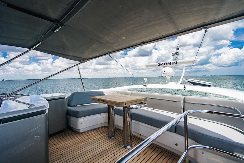 Slide: The Image of Luxury Princess S62 yacht deck with seating, table, and ocean view under a canopy. - 20