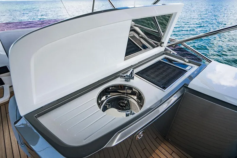 Slide: The Image of Luxury yacht Princess S62 2021 with sleek outdoor kitchen and ocean view. - 21