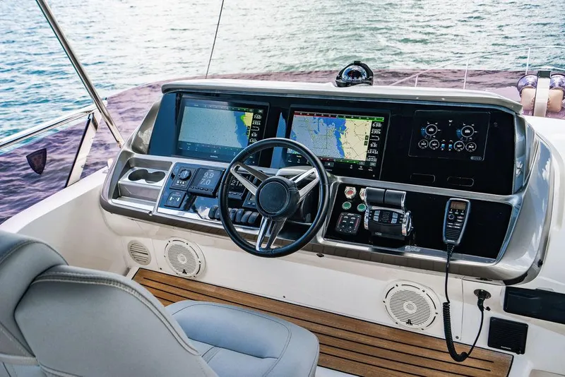 Slide: The Image of Helm of 2021 Princess S62 yacht with advanced navigation systems and luxurious seating. - 23