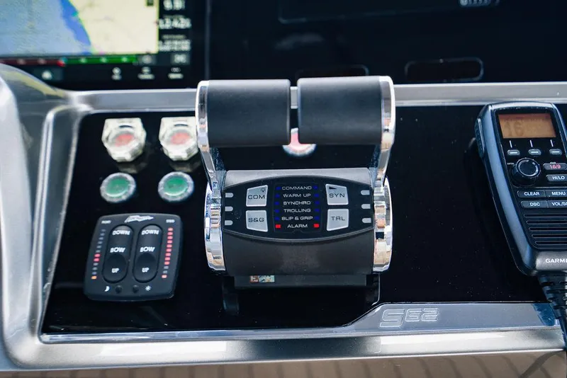 Slide: The Image of Control panel of a 2021 Princess S62 yacht with throttle and communication devices. - 24