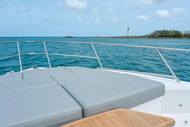 Slide: The Image of Luxury Princess S62 yacht deck with ocean view and distant lighthouse, 2021 model. - 32