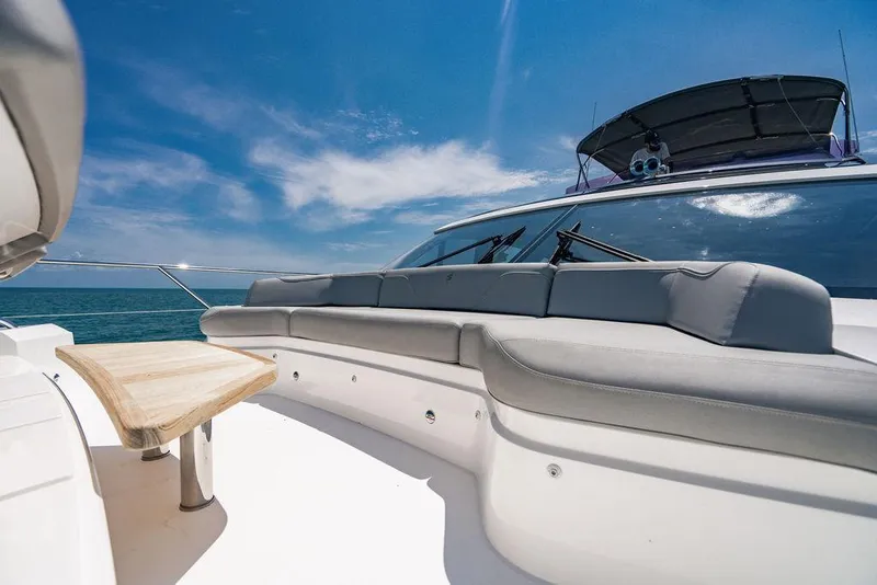 Slide: The Image of Luxurious 2021 Princess S62 yacht deck with seating and table under clear blue sky. - 36