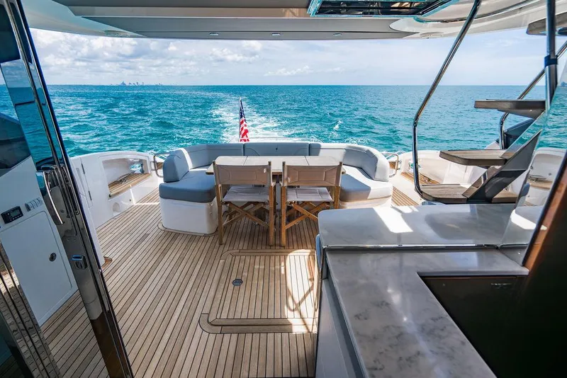Slide: The Image of Luxurious 2021 Princess S62 yacht deck with ocean view and elegant seating area. - 38