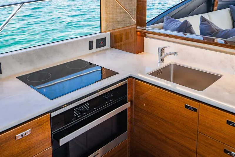 Slide: The Image of Luxurious kitchen in 2021 Princess S62 yacht with modern appliances and sleek design. - 47