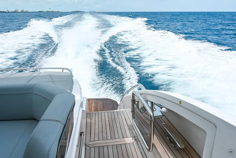 Slide: The Image of 2021 Princess S62 yacht cruising on open sea, view from deck with wake trail. - 7