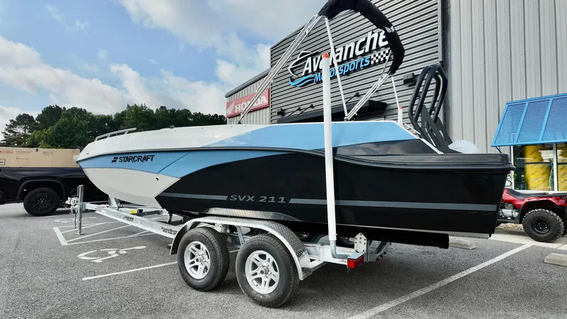 Slide: The Image of 2026 Starcraft SVX 211 OB boat on trailer at dealership. - 6