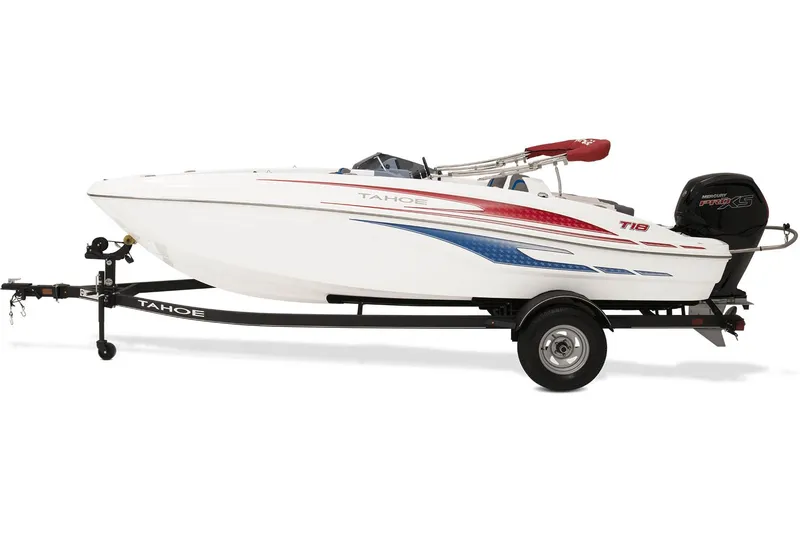 Slide: The Image of 2023 Tahoe T18 boat on trailer, featuring sleek white design with red and blue accents. - 13