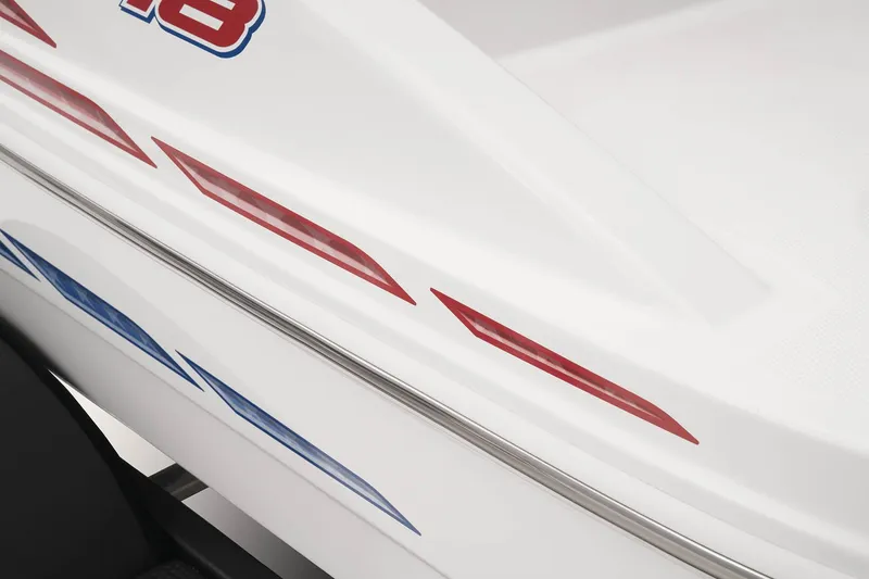 Slide: The Image of 2023 Tahoe T18 boat with red and blue graphics on white hull. - 27