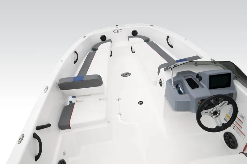 Slide: The Image of 2023 Tahoe T18 boat interior with steering console and seating layout. - 29