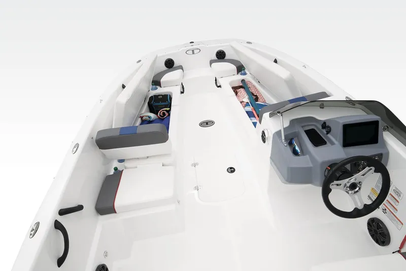 Slide: The Image of 2023 Tahoe T18 boat interior with steering wheel, seating, and storage compartments. - 30