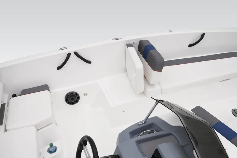 Slide: The Image of 2023 Tahoe T18 boat interior with seating, steering wheel, and cup holder. - 33