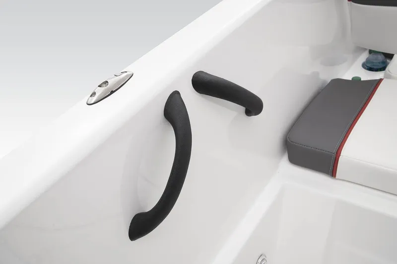 Slide: The Image of 2023 Tahoe T18 boat interior with grab handles and cushioned seating. - 34