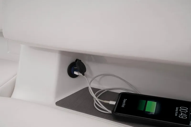 Slide: The Image of 2023 Tahoe T18 interior with phone charging via USB port. - 41