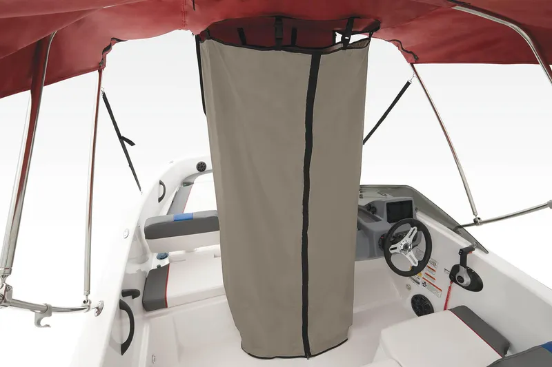 Slide: The Image of 2023 Tahoe T18 boat interior with red canopy and privacy curtain. - 44