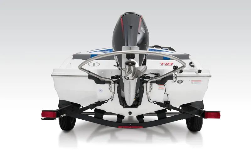 Slide: The Image of 2023 Tahoe T18 boat rear view with outboard motor and trailer. - 50