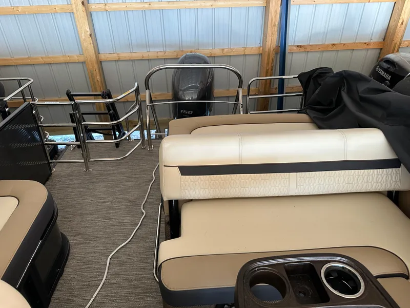 Slide: The Image of 2023 Godfrey SWEETWATER 2286 SFL pontoon boat interior with seating and Yamaha engine. - 19