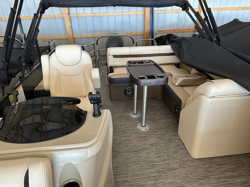 Slide: The Image of 2023 Godfrey SWEETWATER 2286 SFL pontoon boat interior with seating and table. - 20