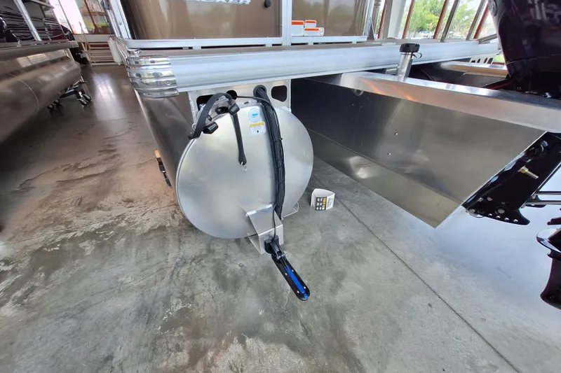 Slide: The Image of 2025 Sun Tracker Sportfish 24 XP3 pontoon boat detail in showroom. - 5