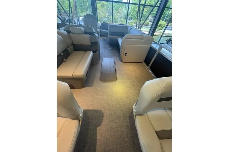 Slide: The Image of Interior of 2025 Sun Tracker Fishin' Barge 22 XP3, featuring spacious seating and modern design. - 8