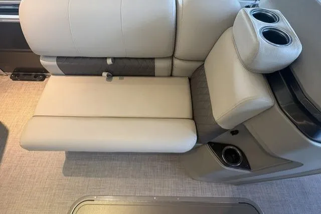 Slide: The Image of 2025 Sun Tracker Fishin' Barge 22 XP3 interior seating with cup holders. - 3