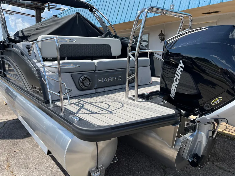 Slide: The Image of 2026 Harris Solstice 230 pontoon boat with Mercury engine, docked and ready for adventure. - 5