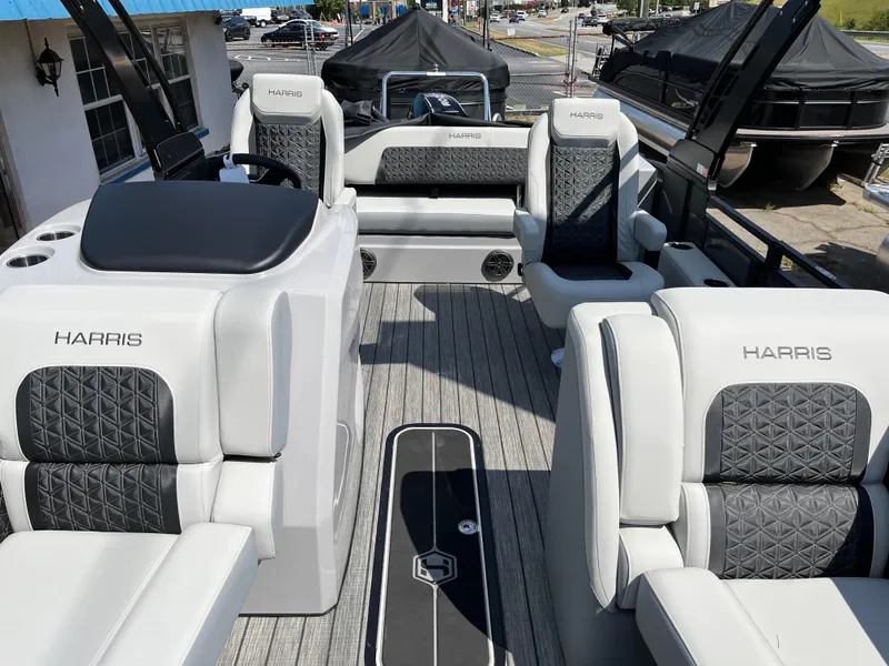 Slide: The Image of 2026 Harris Solstice 230 boat interior with luxurious seating and modern design. - 7