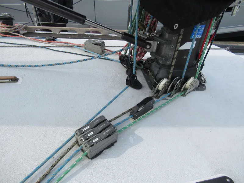 Slide: The Image of Sailing rigging on 1984 Santa Cruz 50 yacht deck with colorful ropes and pulleys. - 10