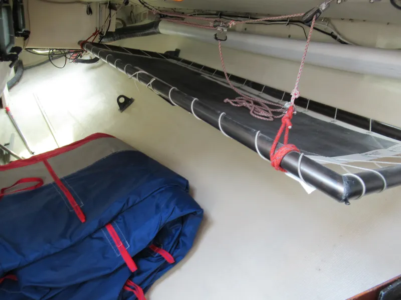 Slide: The Image of Interior of 1984 Santa Cruz 50 sailboat with bunk and stored sails. - 19