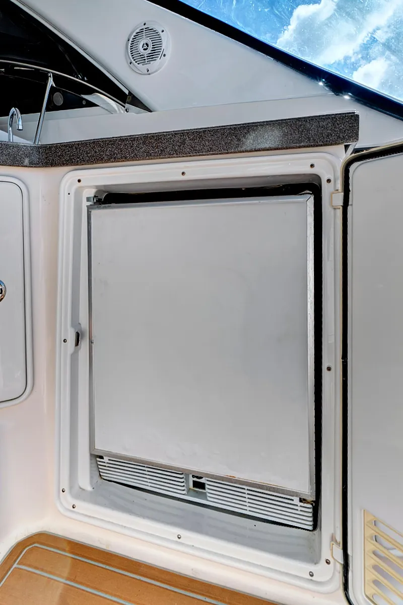Slide: The Image of 2006 Regal 3560 COMMODORE yacht interior with built-in refrigerator. - 11