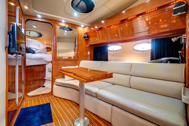 Slide: The Image of Luxurious interior of 2006 Regal 3560 COMMODORE yacht with plush seating and wooden finishes. - 17