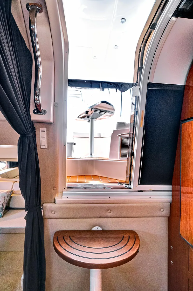 Slide: The Image of Interior view of 2006 Regal 3560 Commodore yacht with elegant seating and modern design. - 24