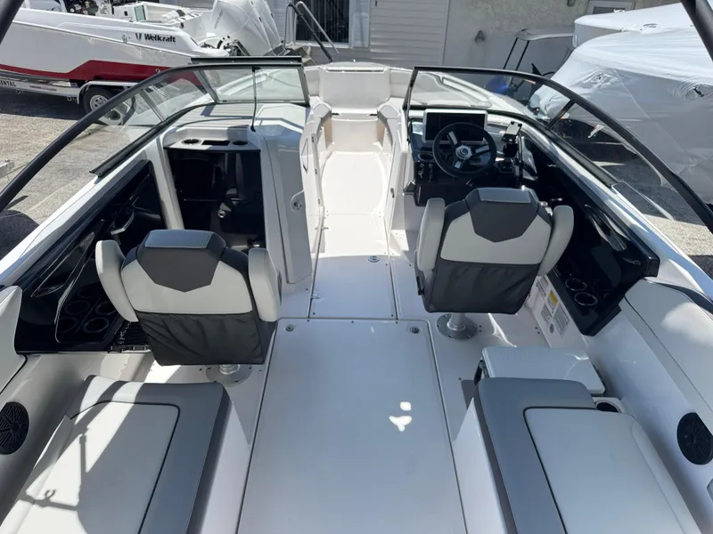 Slide: The Image of 2025 Yamaha Boats AR250 interior with sleek seating and modern dashboard design. - 3