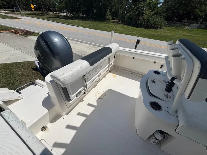 Slide: The Image of 2019 Robalo R222 Center Console boat interior with seating and Yamaha outboard motor. - 10