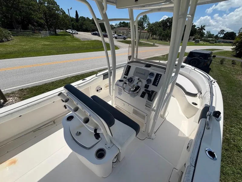 Slide: The Image of 2019 Robalo R222 Center Console boat interior with steering console and seating. - 5